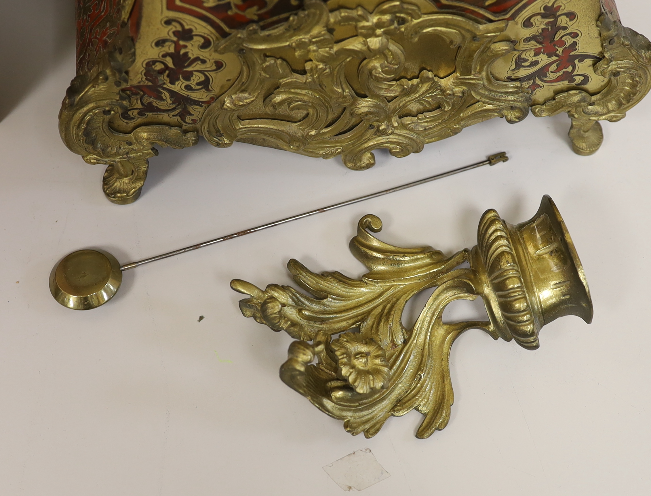 A 19th century Louis XV style red boulle eight day mantel clock